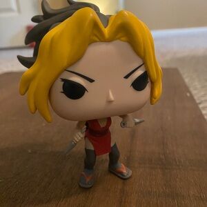 Funko Pop Figure with Yellow Hair and Red Outfit